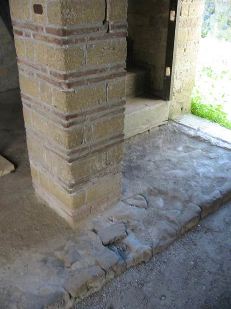 III.14, Herculaneum. May 2003. Room 5, pilaster at base of steps leading to upper floor, rear apartment.
The apartment consisted of an area at the top of the stairs, two cubicula and a long corridor leading to a latrine.
Photo courtesy of Nicolas Monteix.